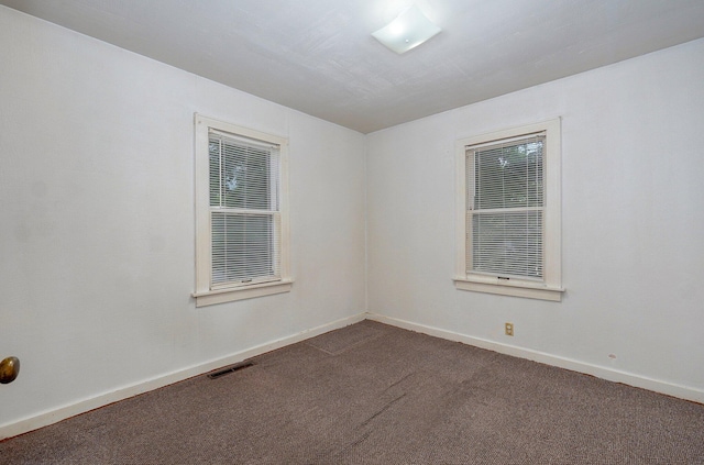 408 S 8th Ave, Ozark, MO 65721 - empty room with dark colored carpet and baseboards