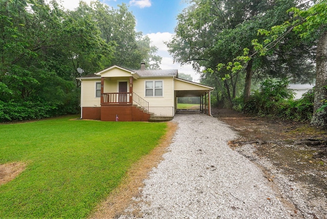 408 S 8th Ave, Ozark, MO 65721 - view of front facade with driveway, a front lawn, an attached carport, and a chimney