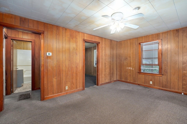 408 S 8th Ave, Ozark, MO 65721 - empty room with ceiling fan, carpet flooring, wood walls, and a smoke detector