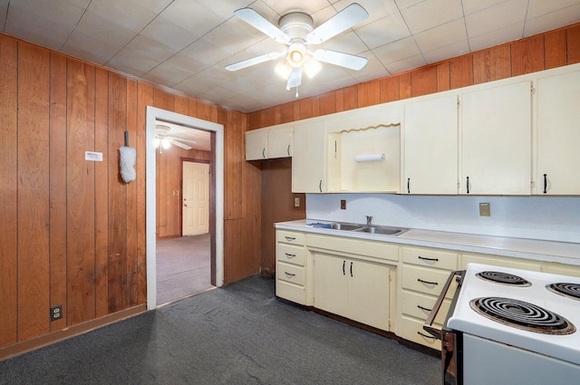408 S 8th Ave, Ozark, MO 65721 - kitchen featuring ceiling fan, light countertops, electric range, wooden walls, and dark carpet