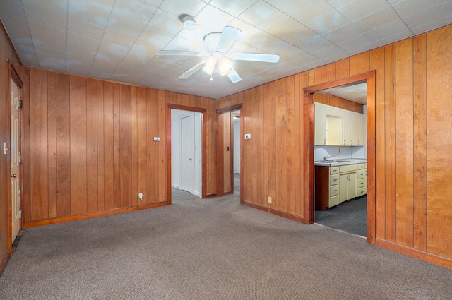 408 S 8th Ave, Ozark, MO 65721 - carpeted spare room with a ceiling fan and wood walls