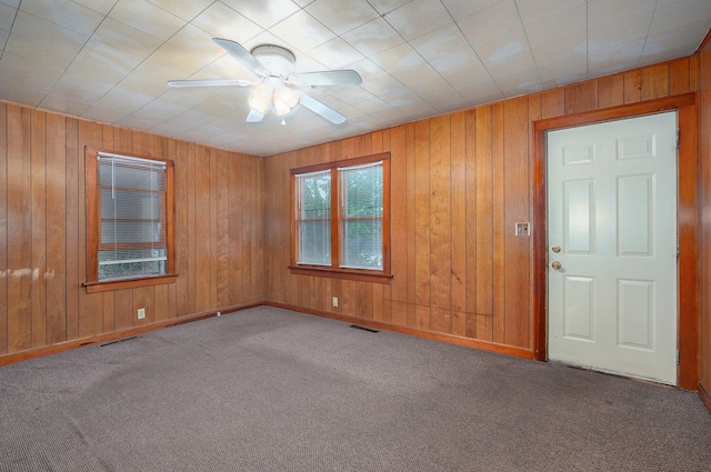 408 S 8th Ave, Ozark, MO 65721 - unfurnished room featuring carpet floors, ceiling fan, and wood walls