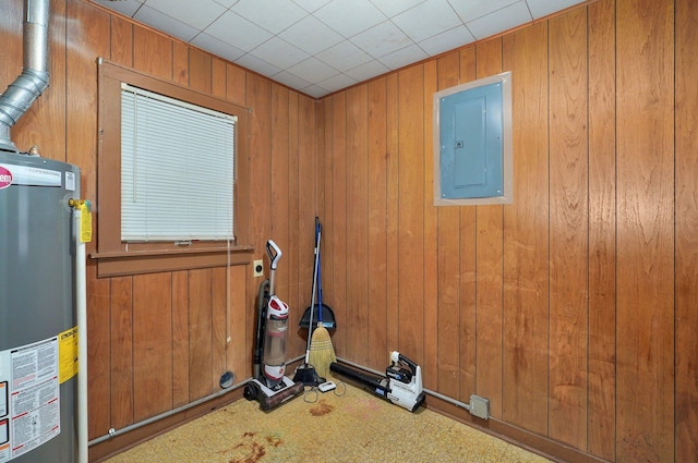 408 S 8th Ave, Ozark, MO 65721 - exercise area with water heater, electric panel, and wood walls