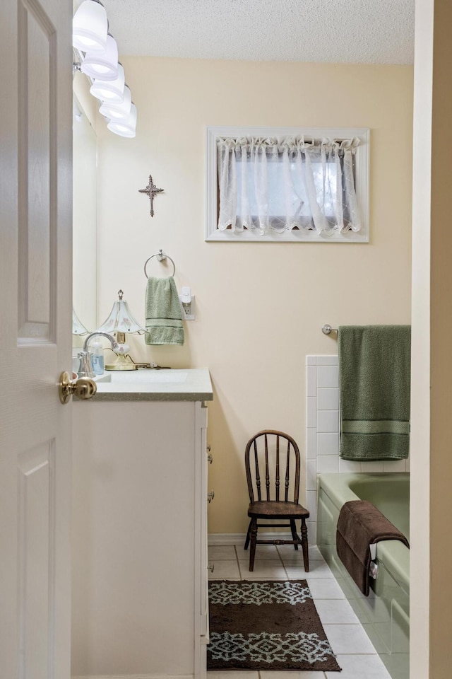 781 Santana Cir, Reeds Spring, MO 65737 - bathroom with a bath, vanity, and tile patterned floors