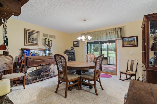 781 Santana Cir, Reeds Spring, MO 65737 - dining area with light colored carpet, a chandelier, and a textured ceiling