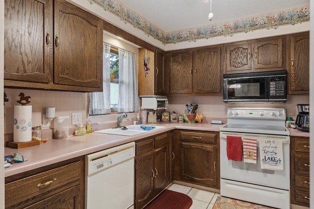 781 Santana Cir, Reeds Spring, MO 65737 - kitchen with white appliances, light countertops, and light tile patterned flooring