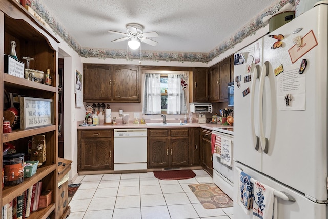 781 Santana Cir, Reeds Spring, MO 65737 - kitchen featuring white appliances, light countertops, ceiling fan, dark brown cabinetry, and a textured ceiling