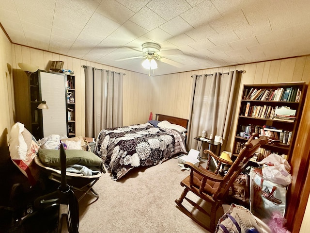 1128 E Crest Dr, Houston, MO 65483 - carpeted bedroom featuring wood walls and ceiling fan