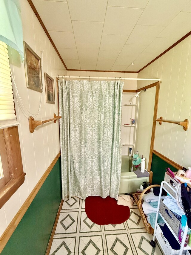1128 E Crest Dr, Houston, MO 65483 - bathroom featuring shower / bath combo, ornamental molding, and wooden walls