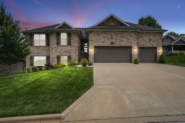 727 S Eleven Point Ln, Nixa, MO 65714 - view of front of property with driveway, a yard, brick siding, and an attached garage