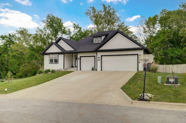 1611 E Hayloft Dr, Ozark, MO 65721 - view of front of house with an attached garage, concrete driveway, and a shingled roof