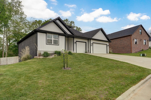 1611 E Hayloft Dr, Ozark, MO 65721 - view of front of house featuring an attached garage, driveway, a front lawn, and board and batten siding