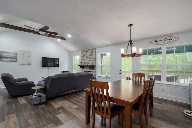1611 E Hayloft Dr, Ozark, MO 65721 - dining space featuring a chandelier, dark wood finished floors, a ceiling fan, a textured ceiling, and a stone fireplace