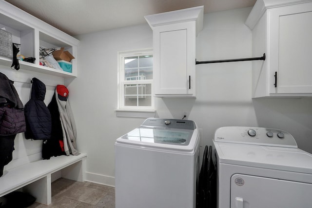 1611 E Hayloft Dr, Ozark, MO 65721 - laundry room with washing machine and clothes dryer, cabinet space, and light stone finish flooring