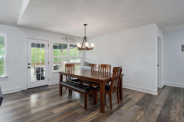 1611 E Hayloft Dr, Ozark, MO 65721 - dining space featuring a chandelier, dark wood-style floors, and a textured ceiling