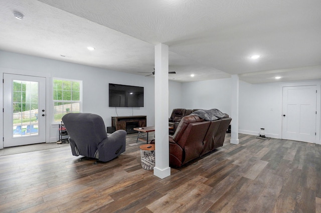 1611 E Hayloft Dr, Ozark, MO 65721 - living room featuring dark wood-style floors, a fireplace, ceiling fan, recessed lighting, and a textured ceiling