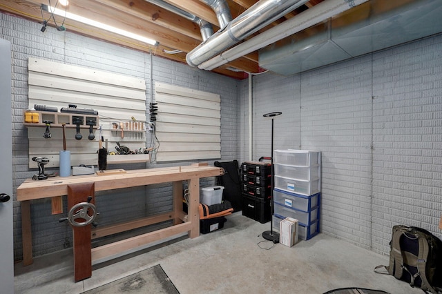 1611 E Hayloft Dr, Ozark, MO 65721 - basement featuring a workshop area and brick wall