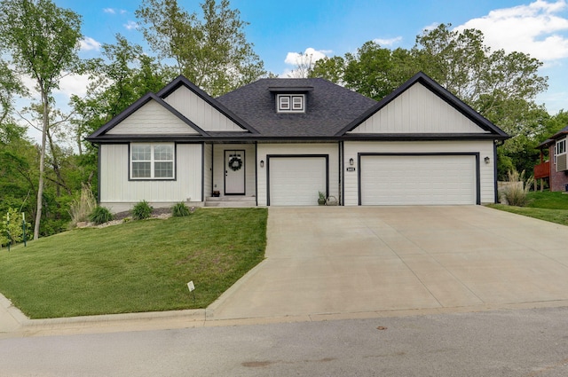 1611 E Hayloft Dr, Ozark, MO 65721 - view of front of property with an attached garage, a front yard, concrete driveway, and a shingled roof