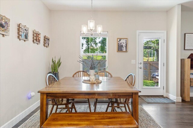 1651 N Penrose Ave, Nixa, MO 65714 - dining space featuring a chandelier and wood finished floors