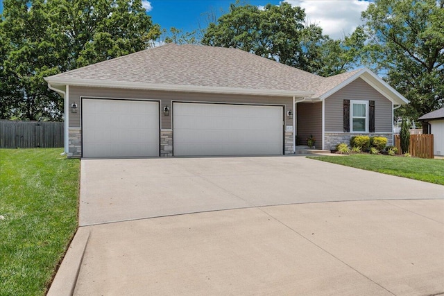 1651 N Penrose Ave, Nixa, MO 65714 - ranch-style house featuring an attached garage, driveway, stone siding, and a shingled roof
