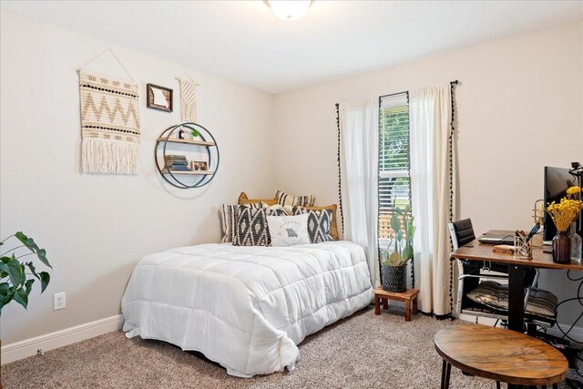 1651 N Penrose Ave, Nixa, MO 65714 - carpeted bedroom featuring a desk and baseboards