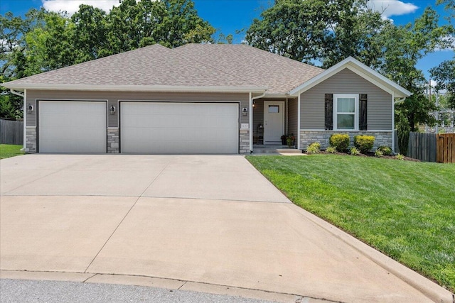 1651 N Penrose Ave, Nixa, MO 65714 - view of front of home with stone siding, a garage, driveway, and a shingled roof