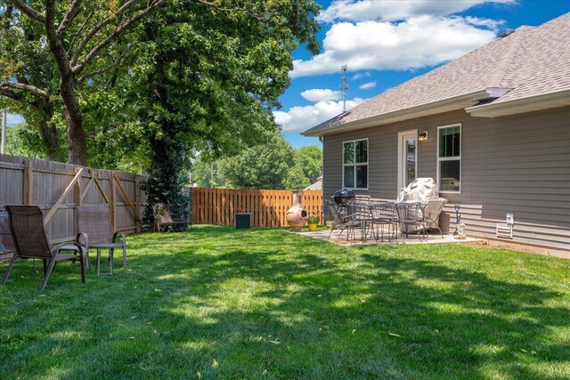 1651 N Penrose Ave, Nixa, MO 65714 - fenced backyard featuring a patio