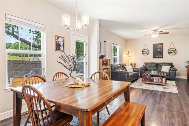1651 N Penrose Ave, Nixa, MO 65714 - dining area with dark wood-type flooring, healthy amount of natural light, a chandelier, and a ceiling fan