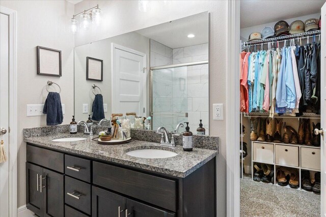 1651 N Penrose Ave, Nixa, MO 65714 - bathroom with double vanity, a stall shower, and a spacious closet