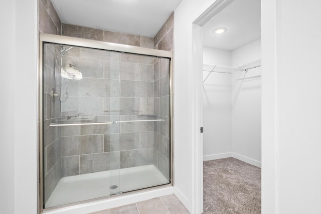 121 S Aspen St, Buffalo, MO 65622 - bathroom featuring a stall shower, a spacious closet, and recessed lighting