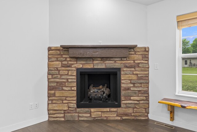 121 S Aspen St, Buffalo, MO 65622 - detailed view of wood finished floors and a fireplace