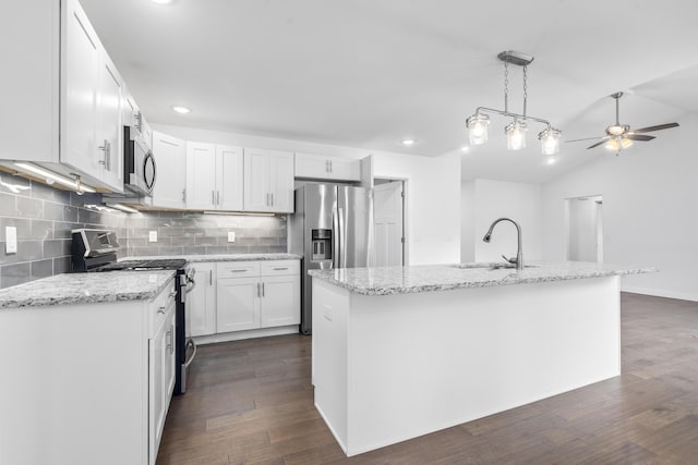 121 S Aspen St, Buffalo, MO 65622 - kitchen featuring stainless steel appliances, ceiling fan, decorative backsplash, white cabinets, and light stone countertops