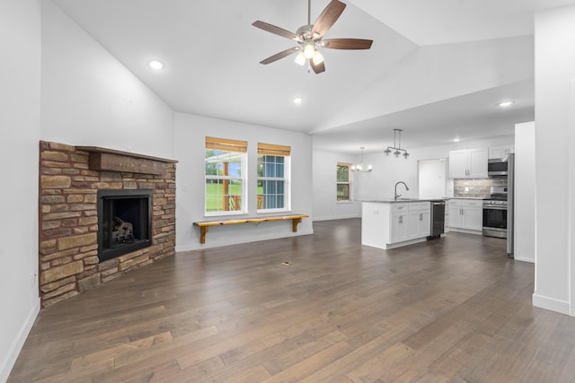 121 S Aspen St, Buffalo, MO 65622 - unfurnished living room with lofted ceiling, a ceiling fan, a fireplace, dark wood-style flooring, and recessed lighting