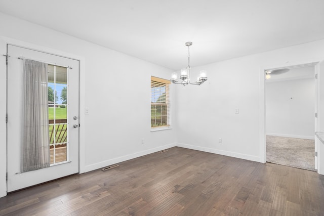 121 S Aspen St, Buffalo, MO 65622 - unfurnished dining area featuring a chandelier and wood finished floors