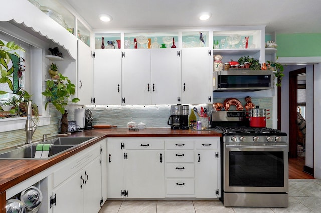 223 E Mill St, Republic, MO 65738 - kitchen featuring stainless steel appliances, open shelves, butcher block countertops, white cabinets, and recessed lighting