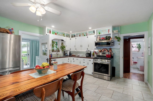 223 E Mill St, Republic, MO 65738 - kitchen with appliances with stainless steel finishes, dark countertops, white cabinets, and open shelves