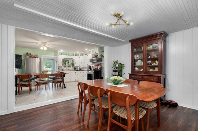 223 E Mill St, Republic, MO 65738 - dining space with wood finished floors, a chandelier, and a ceiling fan