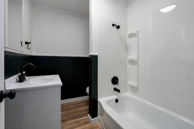 1317 S Willow Ave, Springfield, MO 65804 - full bathroom featuring wood finished floors, vanity, and shower / washtub combination