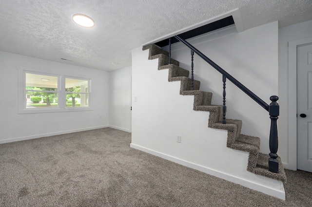 1317 S Willow Ave, Springfield, MO 65804 - stairway with a textured ceiling and carpet