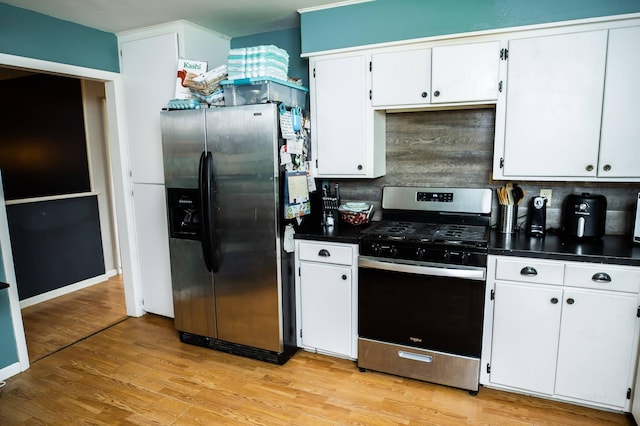 343 N Wood Ln, Fair Grove, MO 65648 - kitchen with appliances with stainless steel finishes, decorative backsplash, dark countertops, light wood-style floors, and white cabinetry