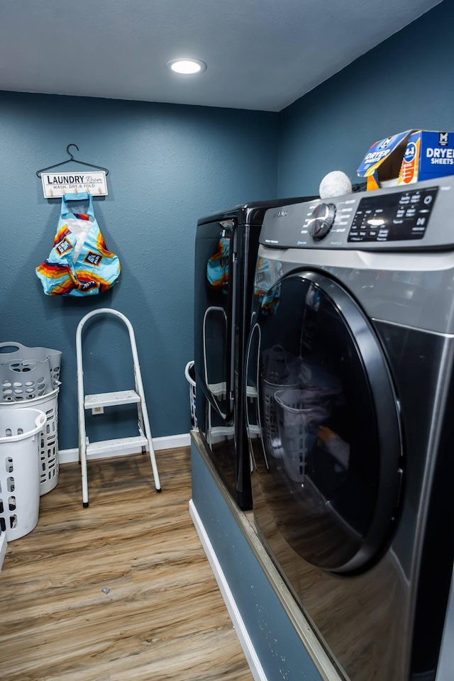 343 N Wood Ln, Fair Grove, MO 65648 - laundry room featuring wood finished floors and washer and clothes dryer