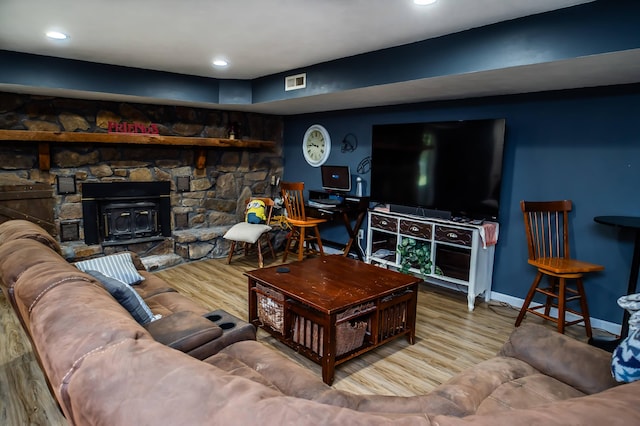 343 N Wood Ln, Fair Grove, MO 65648 - living room with wood finished floors, recessed lighting, and a wood stove