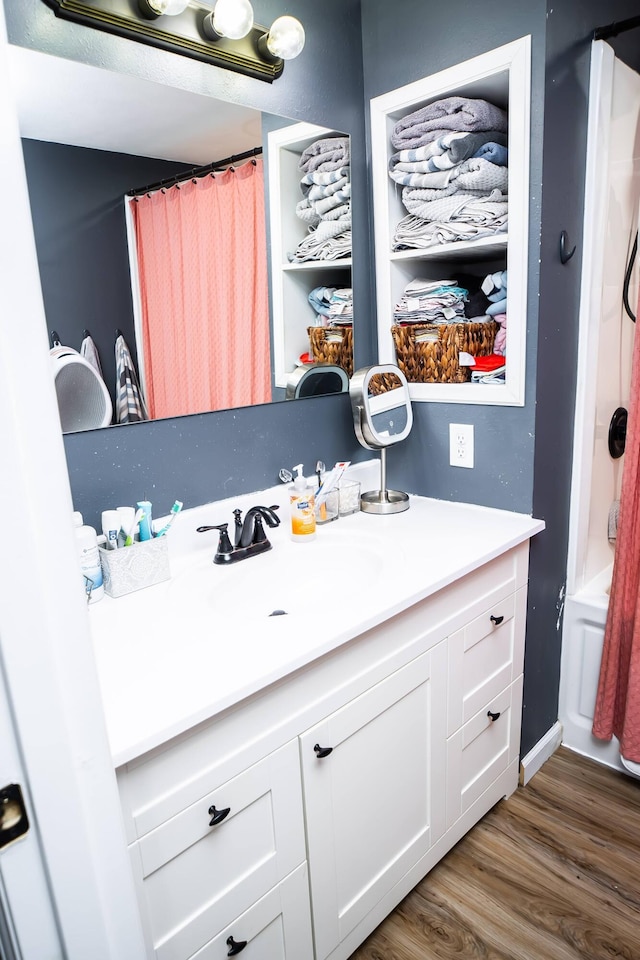 343 N Wood Ln, Fair Grove, MO 65648 - bathroom with vanity, wood finished floors, and a shower with shower curtain