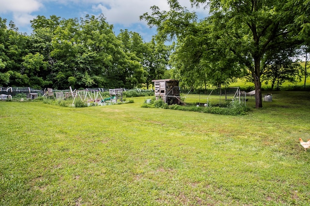 343 N Wood Ln, Fair Grove, MO 65648 - view of grassy yard featuring an outbuilding