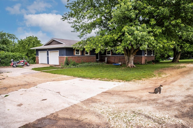 343 N Wood Ln, Fair Grove, MO 65648 - view of front of property with brick siding, driveway, a garage, and a front lawn