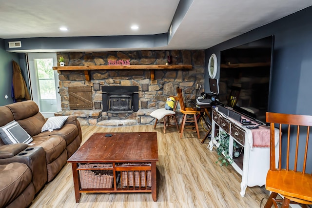 343 N Wood Ln, Fair Grove, MO 65648 - living room featuring wood finished floors and a wood stove