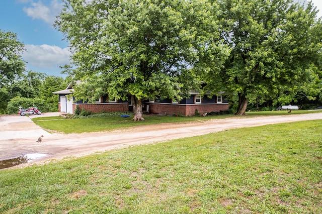 343 N Wood Ln, Fair Grove, MO 65648 - view of property exterior with dirt driveway and a lawn