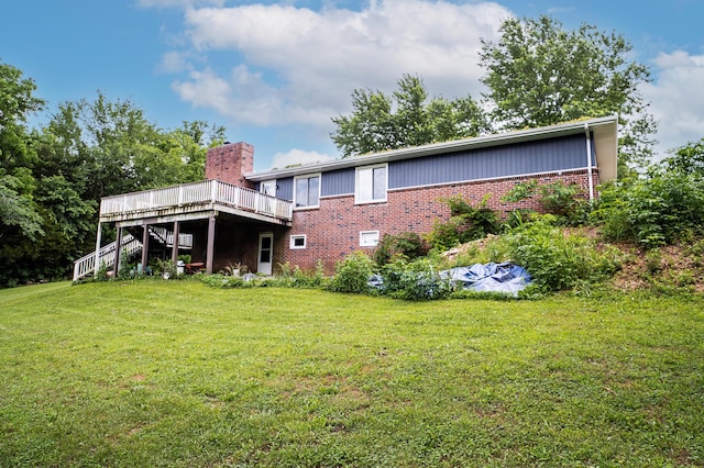 343 N Wood Ln, Fair Grove, MO 65648 - rear view of property featuring brick siding, stairway, a deck, a yard, and a chimney