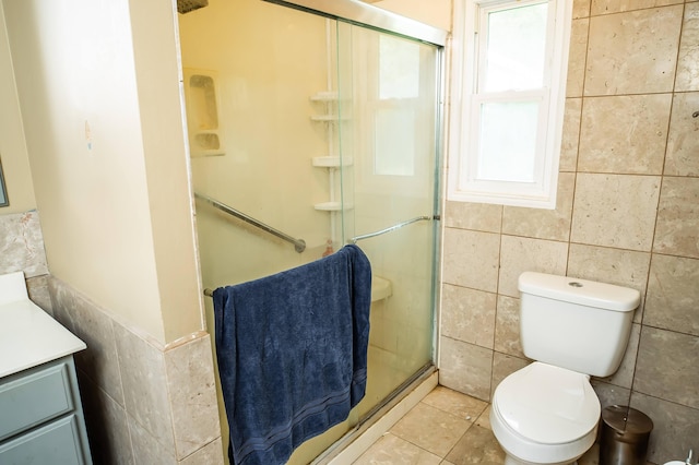 343 N Wood Ln, Fair Grove, MO 65648 - full bath featuring tile walls, a shower stall, vanity, and tile patterned flooring