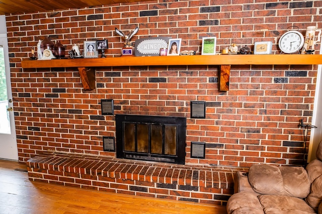 343 N Wood Ln, Fair Grove, MO 65648 - detailed view of wood finished floors, wood ceiling, and a fireplace